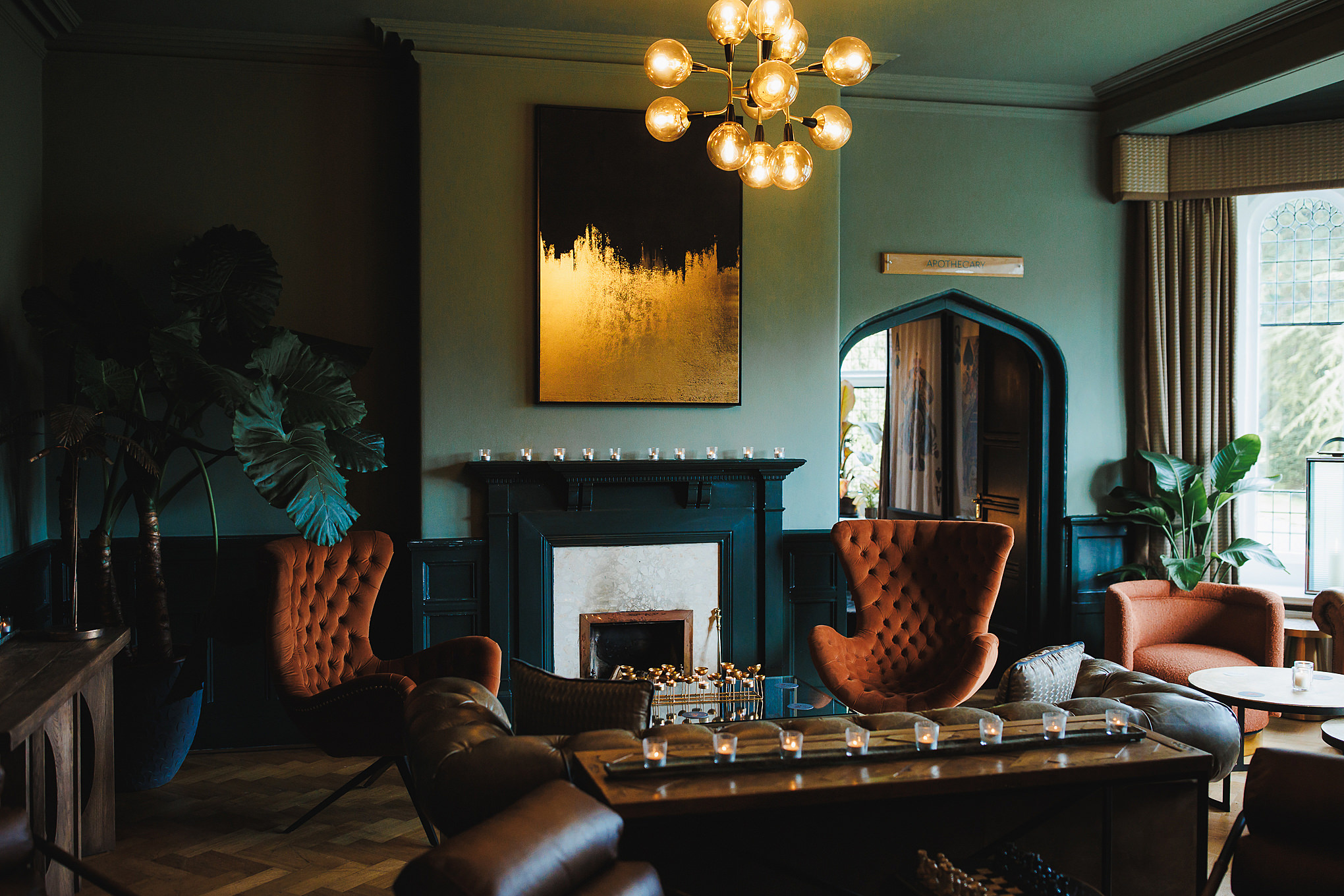 SOHA Retreats | The Autumn Reset Candlelit sitting room with velvet armchairs